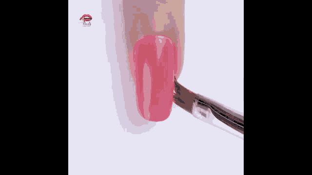 a person is painting their nails with pink nail polish .