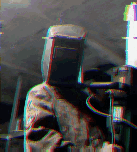 a blurry image of a man wearing a helmet