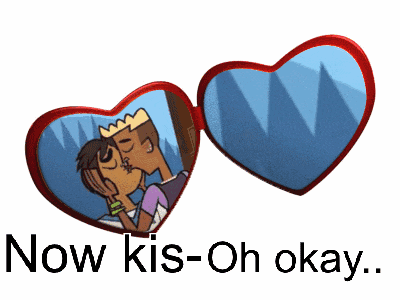 a heart shaped mirror with a picture of two people kissing and the words now kiss-oh-okay