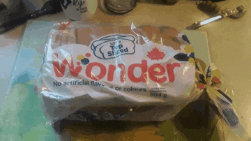 a loaf of wonder bread sits on a counter