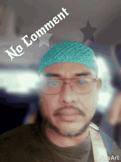 a man wearing glasses and a blue headband has a no comment sign above him
