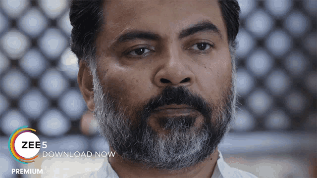 a man with a beard is featured in a zee5 ad