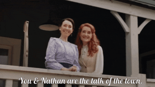 two women standing on a balcony with the words you and nathan are the talk of the town