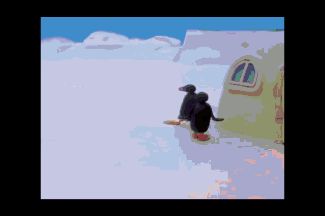 a couple of penguins are standing in front of a house