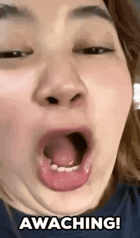 a woman is making a funny face with her mouth open and the words awaching written on the bottom .