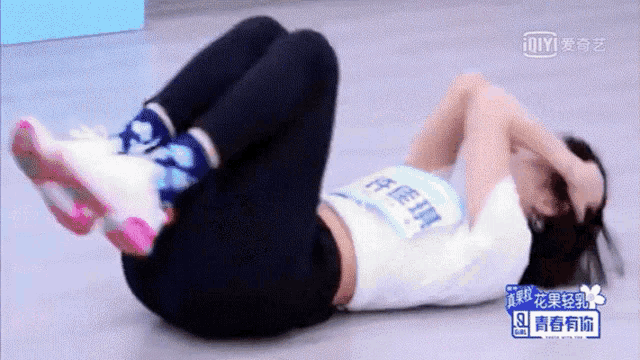 a woman laying on her stomach with a name tag that says ' iiyi '