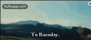 a person is standing in front of a mountain with the words `` tu raenday '' written on the bottom .