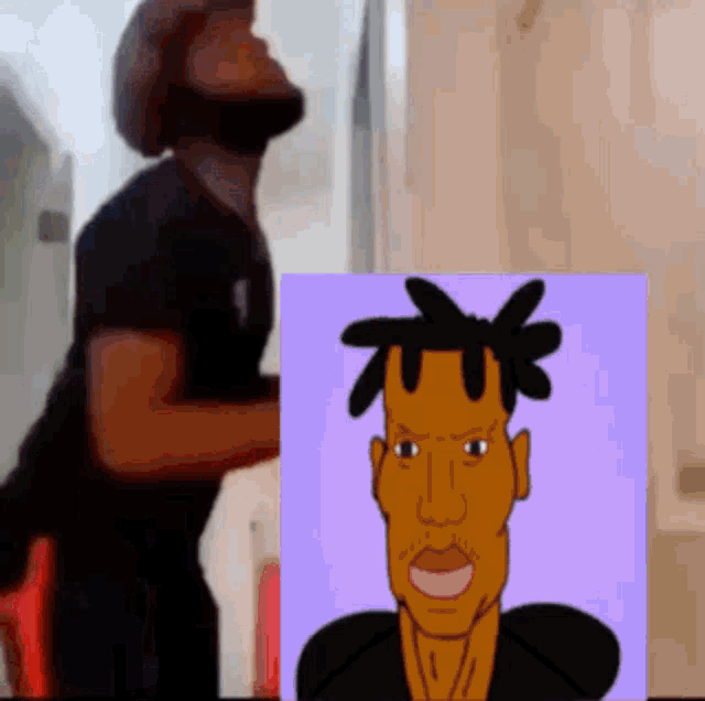 a man in a black shirt is standing next to a cartoon drawing of a man with dreadlocks