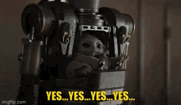a baby yoda is sitting on the back of a robot and saying yes .