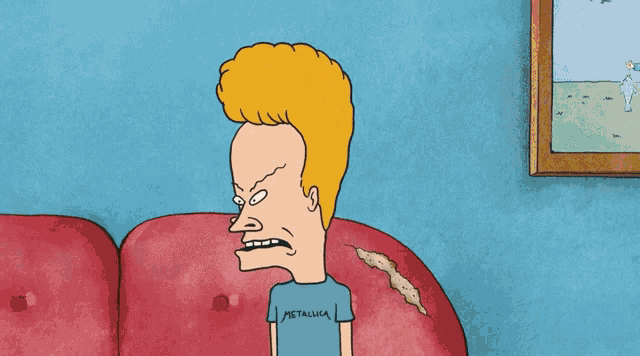 a cartoon character wearing a metallica shirt sitting on a red couch