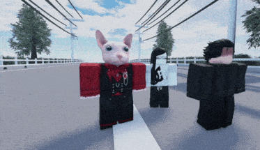 a cat wearing a red shirt that says ' u.o.o. ' on it