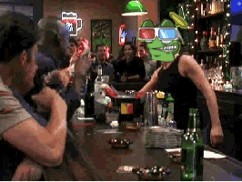 a man wearing 3d glasses is standing at a bar with a frog on his head