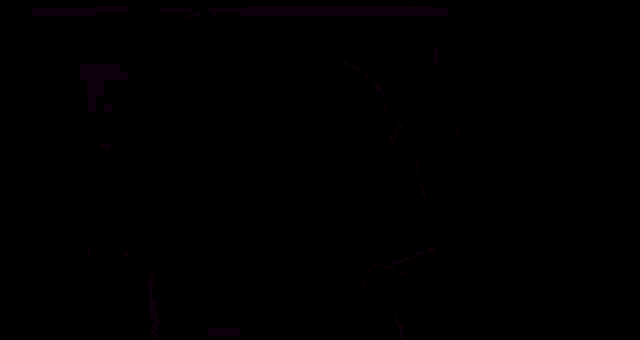 a man wearing a helmet and goggles is standing in the dark