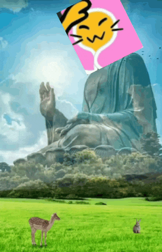 a picture of a statue with a smiley face on it and a deer in the foreground