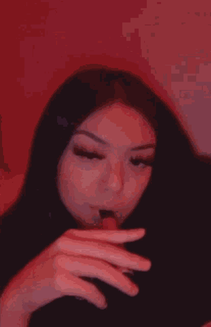 a woman is taking a picture of herself with her phone .