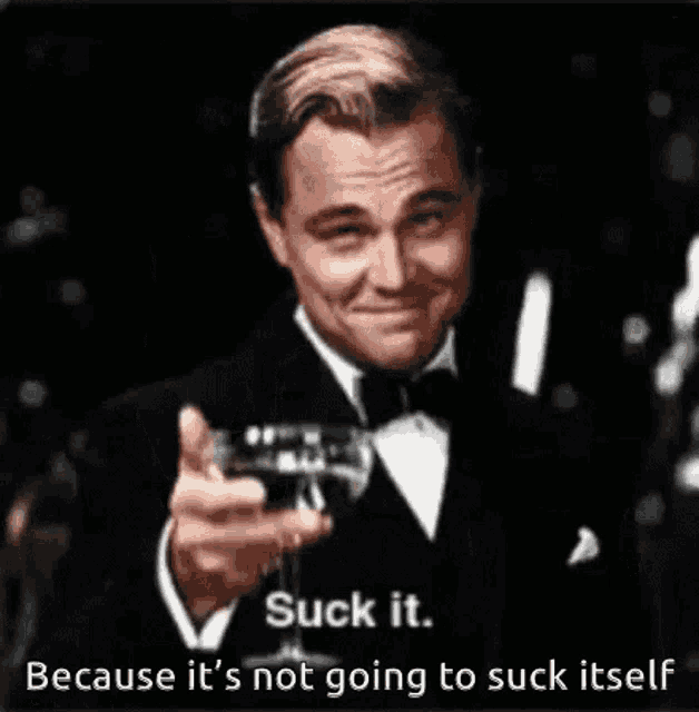 a man in a tuxedo is holding a wine glass and saying suck it