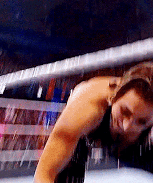 a woman is standing in a boxing ring with a blurred background