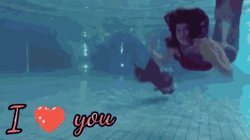 a mermaid is swimming in a pool with the words i love you