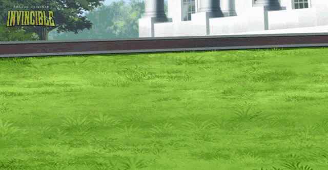 the word invincible that is on a grassy field