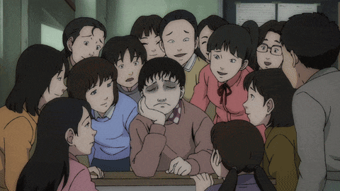 a group of people are gathered around a boy with his hand on his face