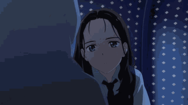a girl with a hood on her head looks at something