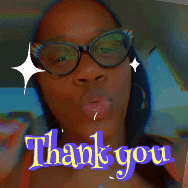 a woman wearing glasses says thank you in purple letters