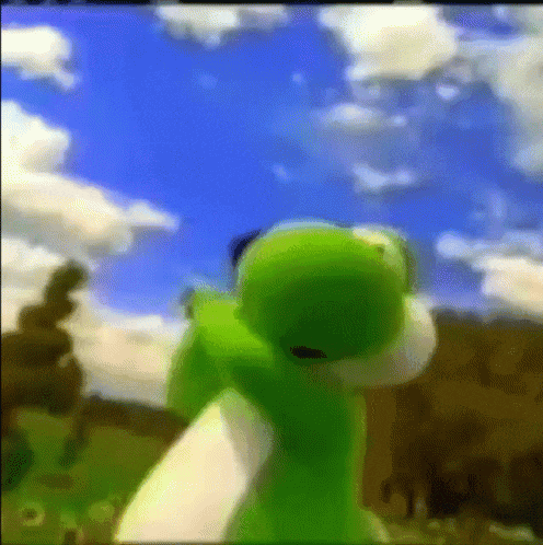 a green yoshi is standing in front of a blue sky and clouds