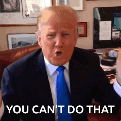 a man in a suit and tie is making a funny face and says you can t do that