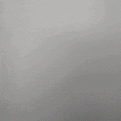 a blurry picture of a woman 's face with a white shirt on .