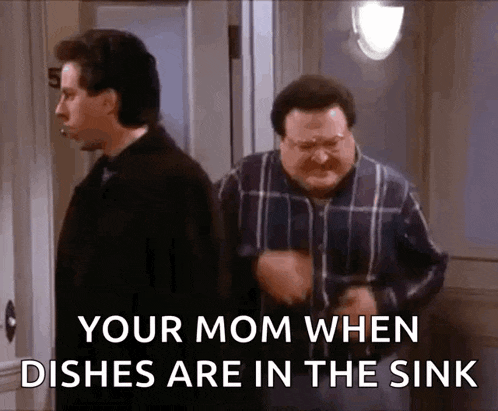 two men are standing next to each other in a room and one of them says " your mom when dishes are in the sink "