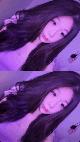 a girl with long purple hair is taking a picture of herself