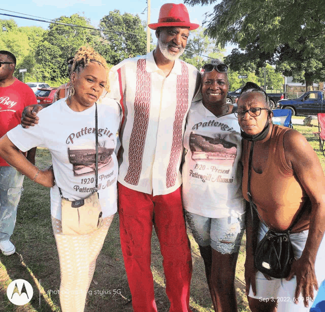 a group of people posing for a picture with one wearing a shirt that says pattensville