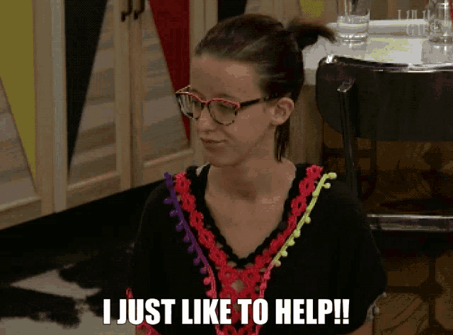 a woman wearing glasses and a colorful shirt says i just like to help