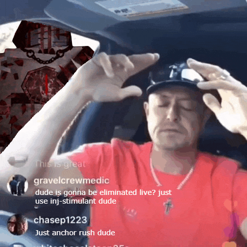 a man in a red shirt is sitting in the driver 's seat of a car with his hands on his head