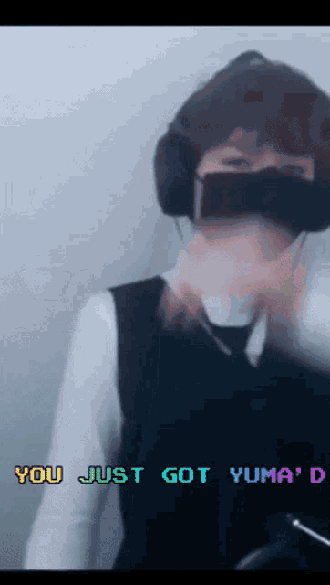 a woman wearing headphones and a mask says you just got yuma '