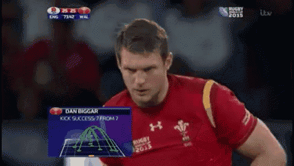 a man in a red under armour shirt is on a tv screen