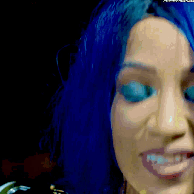 a close up of a person 's face with the next thing written on the bottom right