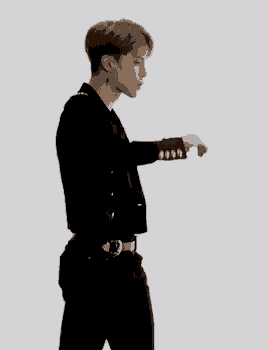 a man wearing a black shirt and black pants with a belt with a silver buckle
