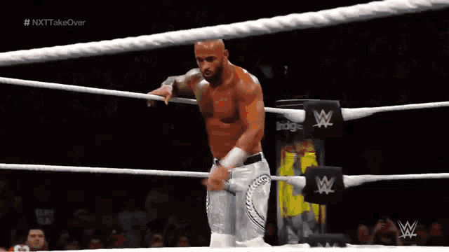 a wrestling match is being shown on tv with the hashtag # nxttakeover