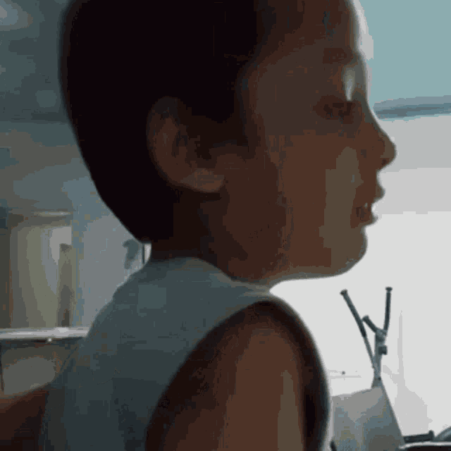 a close up of a young boy 's face with his mouth open .