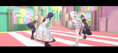 a group of anime girls are dancing on a red carpet in a room .