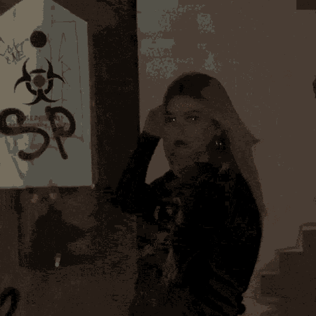 a pixelated image of a woman 's face with a blurred background