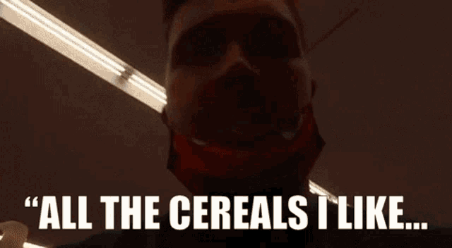 a man wearing a face mask says " all the cereals i like "