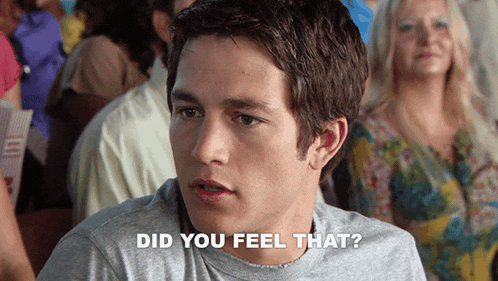 a man sitting in a crowd with the words " did you feel that " next to him