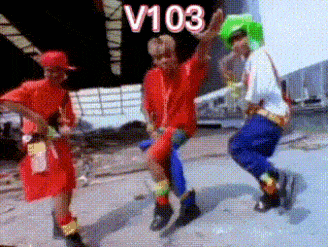a group of people are dancing in a video with the number v103 on the bottom .