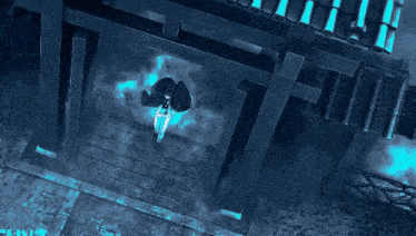 a person is standing on a pile of rocks in front of a blue flame .