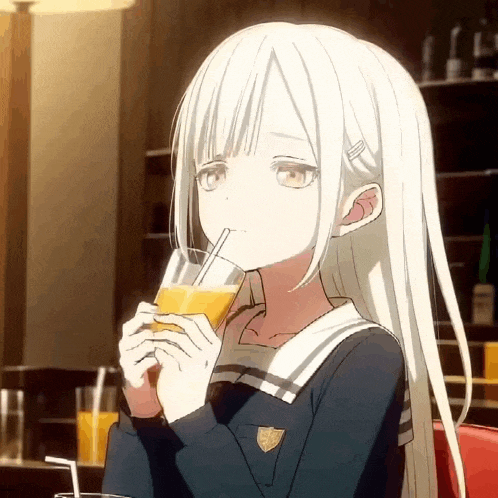 a girl with white hair is drinking a glass of orange juice .