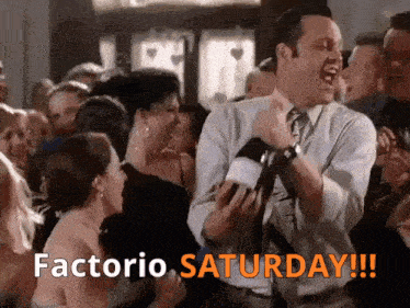 a man in a suit and tie is dancing in a crowd with the words factorio saturday below him