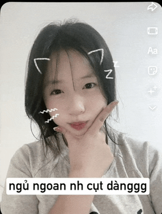 a girl with a cat ear on her head and a caption that says " ngoan nh cut danggo "