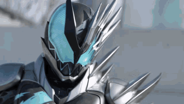 a close up of a person wearing a helmet with sharp spikes